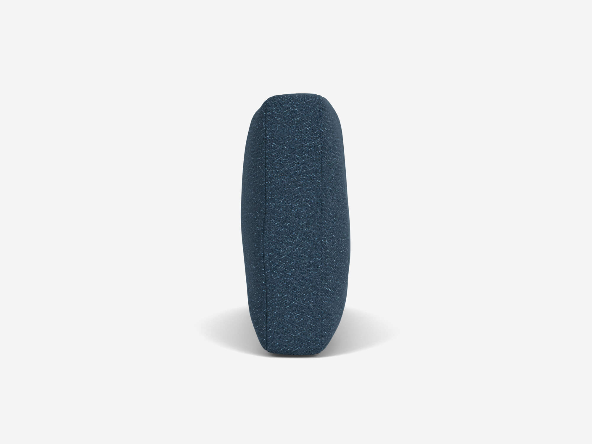 Small blue fabric lumbar pillow side view